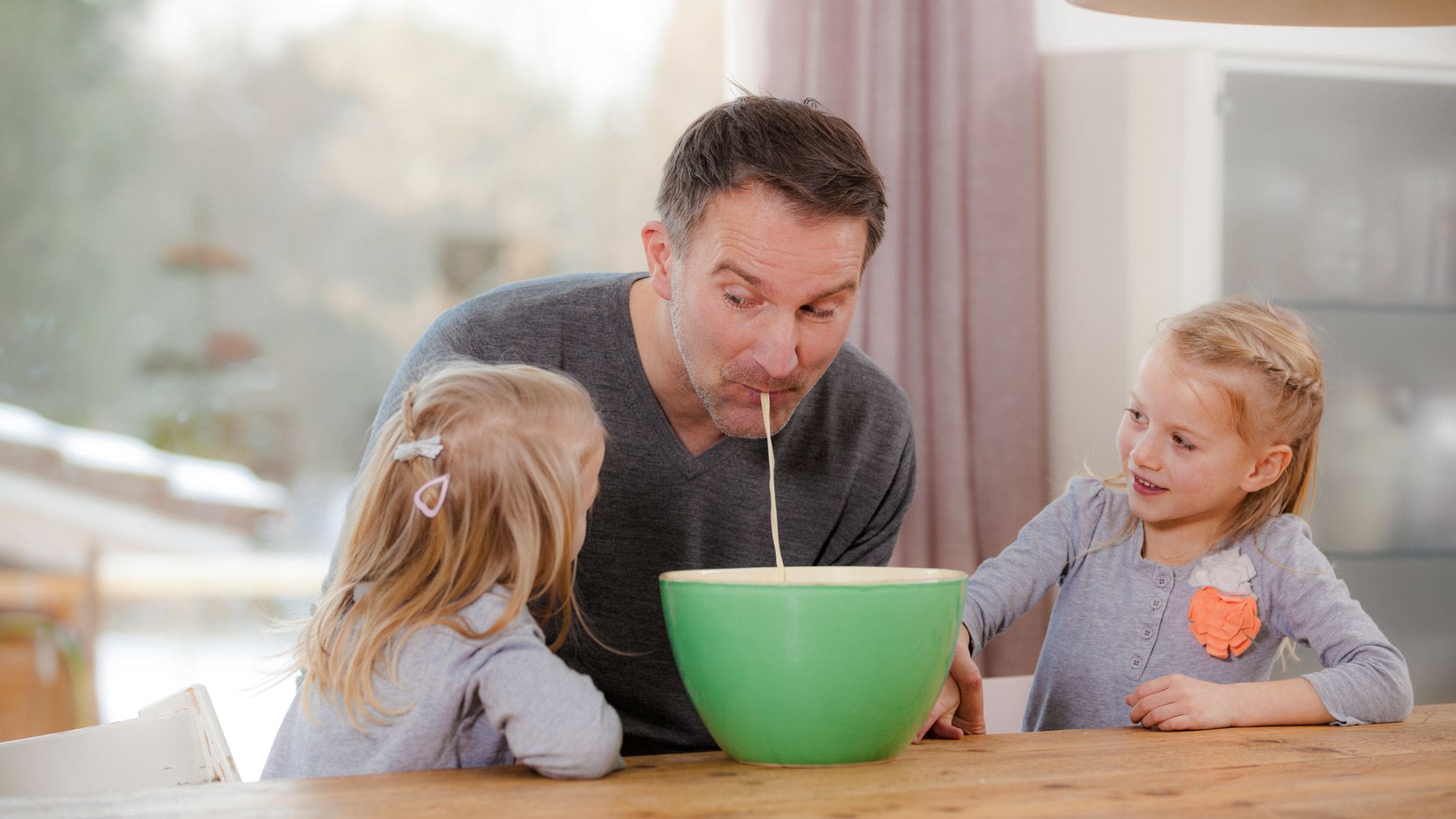 father having fun with his 2 daughters. 150+ Best Dad Jokes That Are Actually Funny